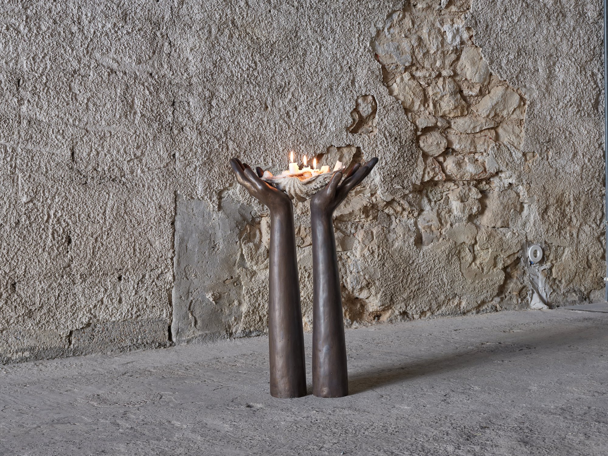 Anna Boghiguian, Candle Holder, cast bronze hands with natural shell, 71.5 x 44.3 x 18 cm, 2024.