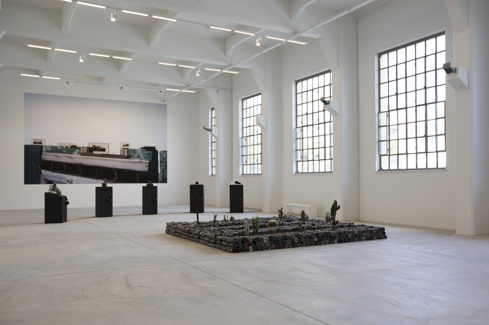 Liliane Lijn, Early Events, Five sculptures, patinated bronze, freestanding painted MDF bases and media players, dimensions variable, 1996-2000. Installation view, Portals, NEON, Former Tobacco Factory, 2021