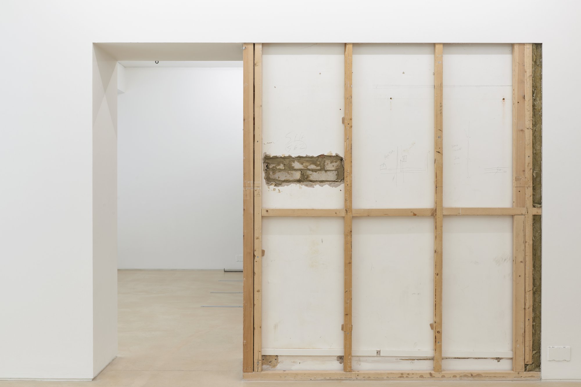 Iris Touliatou, PARTYWALL COMMON FIT, alteration to Peer gallery wall, grey paint, brick, wood, concrete, plasterboard, 229 x 202 x 59.5 cm, 2023Installation view, Iris Touliatou, Outfits, Peer, London, 2023